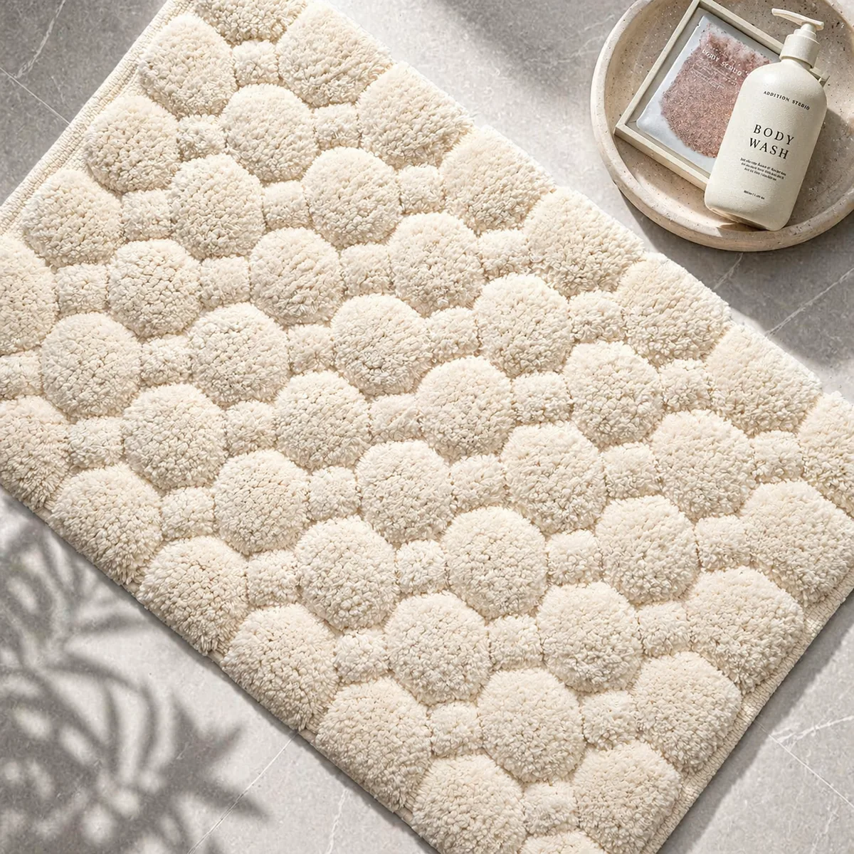 Woven cotton bath mat with pebble relief