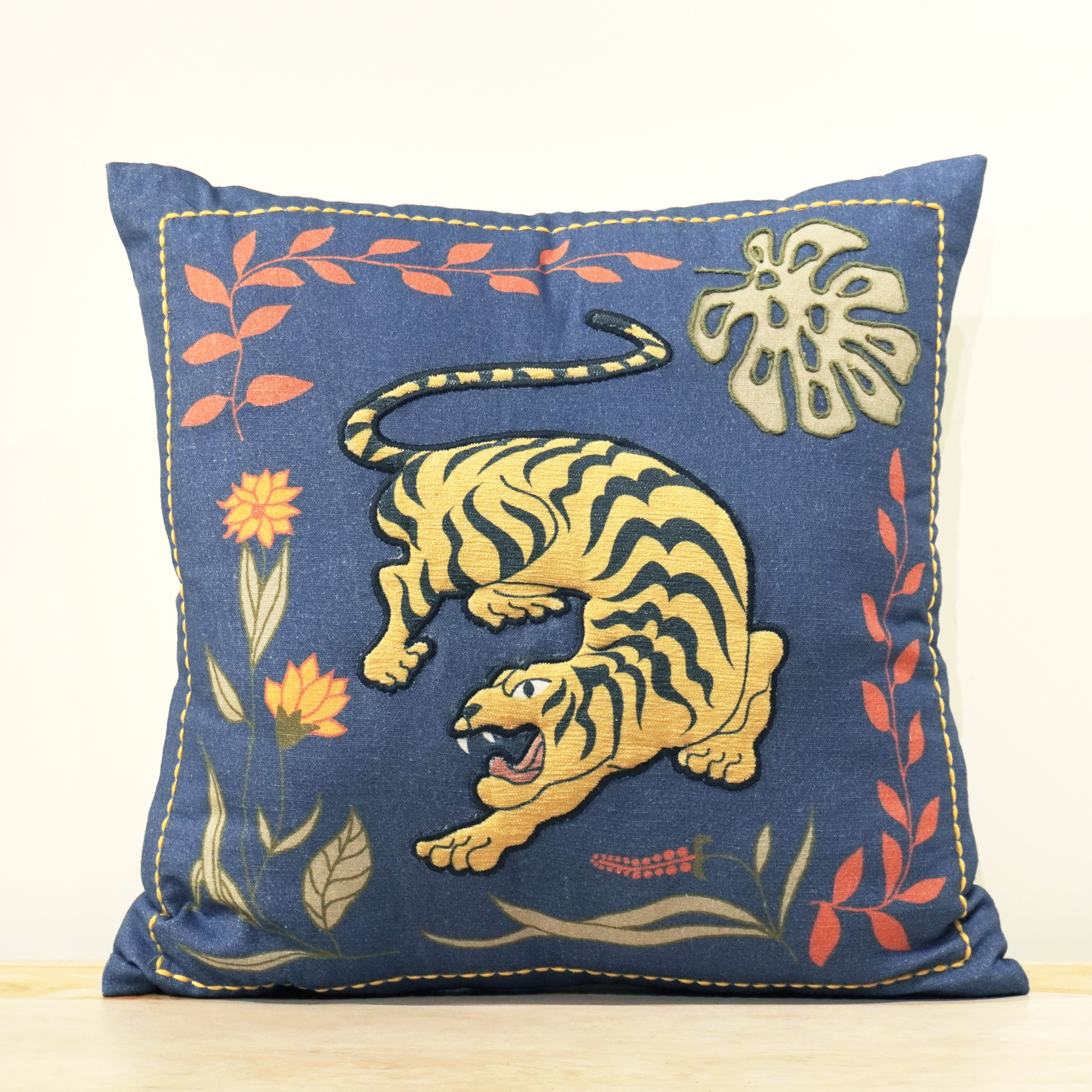 Royal Bengal Tiger hand embroidered cushion on rich indigo with tropical botanicals