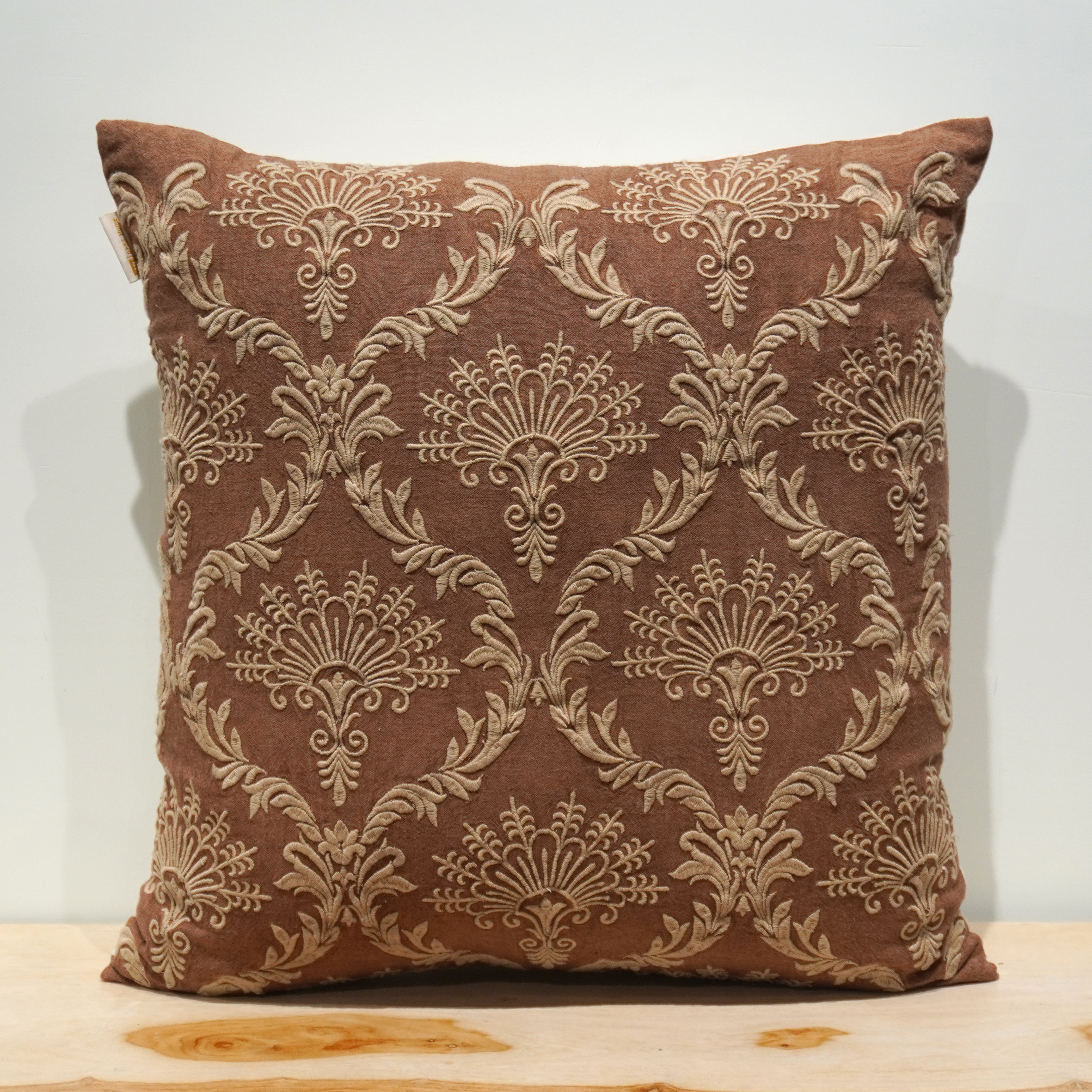 Deep brown square cushion with golden damask fan scroll embroidery
