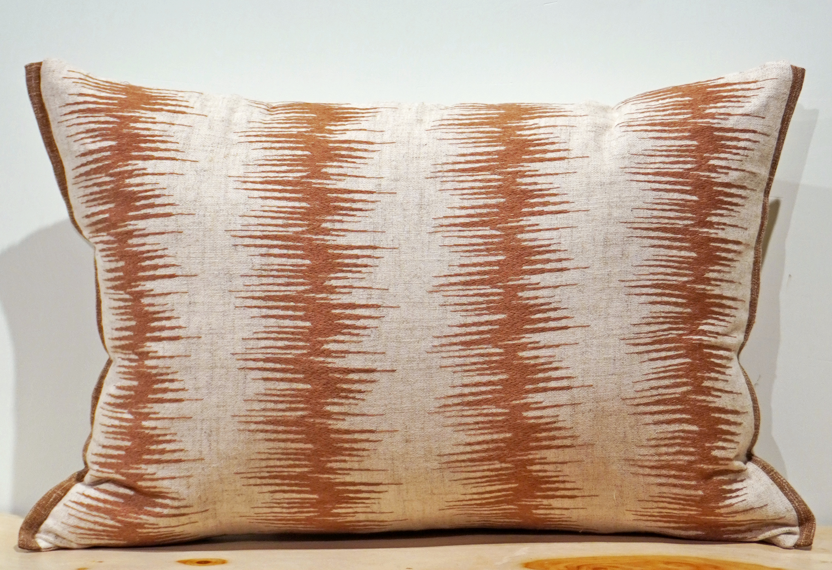 Cream linen lumbar with rust terracotta ikat vertical stripe embroidery