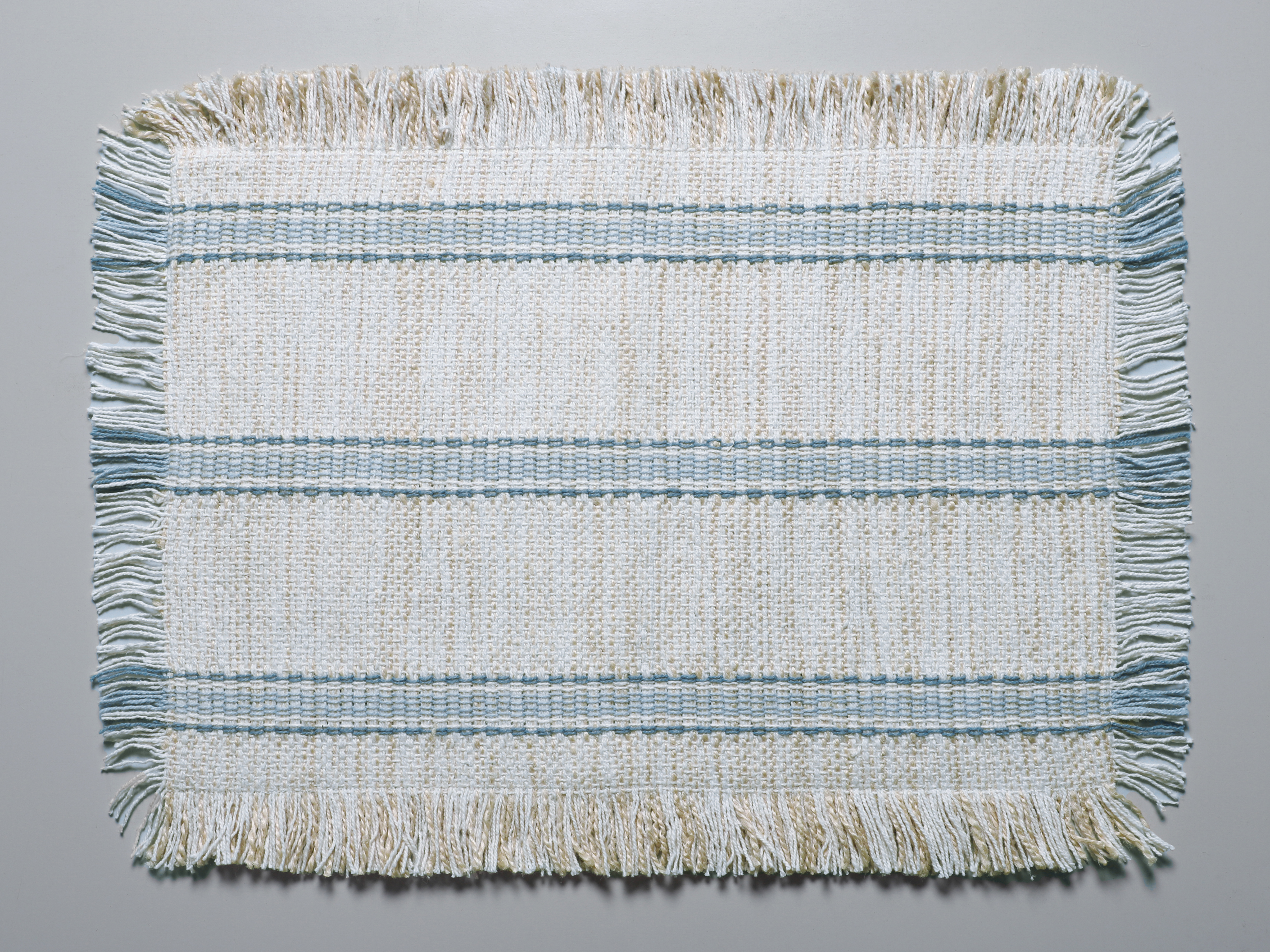 AH-KD-PM-014 Natural Slub Weave Pale Blue Stripe Fringed Placemat